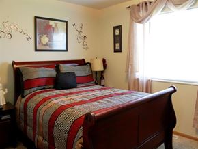 Shakopee apartment for rent - a bedroom with a bed and a window