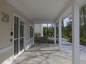 South Berwick apartment for rent - A porch with a bench and pillars.