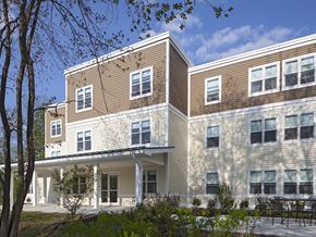 South Berwick apartment for rent - A modern building with a mix of beige and brown siding.