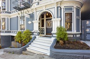 San Francisco apartment for rent - A blue and white building with a black awning.