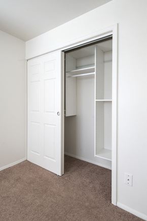 Cohoes apartment for rent - an empty closet in a bedroom with a white door