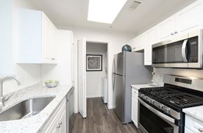 Shrewsbury apartment for rent - a kitchen with stainless steel appliances and white cabinets