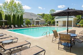 Shrewsbury apartment for rent - our apartments have a swimming pool with chairs and umbrellas