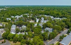 Lindenwold apartment for rent - A bird's eye view of a residential area with houses and trees.