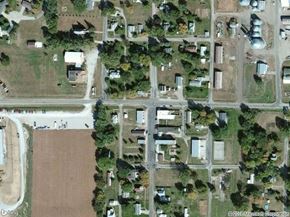 Thurston apartment for rent - A satellite image of a residential area with houses and a large open field.