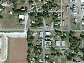 Thurston apartment for rent - an aerial view of a street with houses and trees