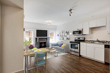 Denver apartment for rent - a kitchen and living room with a table and chairs