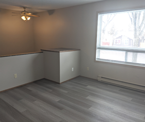 Brandon apartment for rent - A room with a ceiling fan and a window.