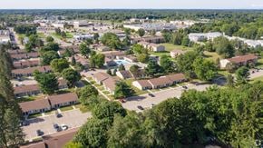 Portage apartment for rent - an aerial view of a suburban neighborhood with houses and trees