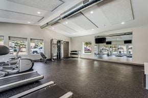 Portage apartment for rent - a gym with treadmills and other exercise equipment and a large window