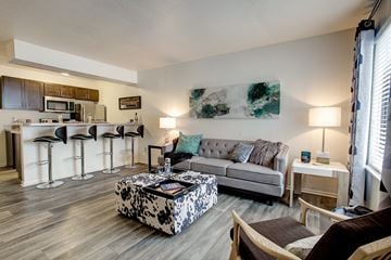 Portage apartment for rent - a living room and kitchen with a couch and a table