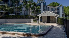 Altamonte Springs apartment for rent - a swimming pool in front of an apartment building