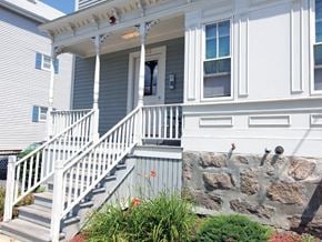 Fall River apartment for rent - the front porch of a house with stairs and a stone wall