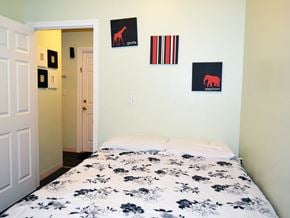 Fall River apartment for rent - a bedroom with a bed and pictures on the wall