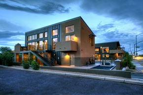 Tucson apartment for rent - a house with glass windows at night with the sky