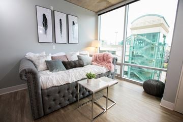 Grand Rapids apartment for rent - a living room with a couch and a view of a building