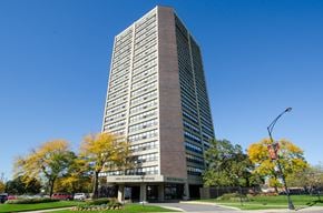 Chicago apartment for rent - a tall building with a blue sky in the background