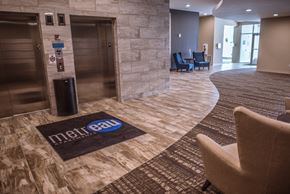 Green Bay apartment for rent - A hallway with a carpet that says metra ea on it.