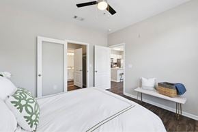 Mount Pleasant apartment for rent - A bedroom with a white bed and a ceiling fan.
