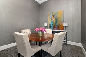 Raleigh apartment for rent - a dining room with a table and chairs and a painting on the wall