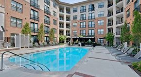 Raleigh apartment for rent - a swimming pool in front of an apartment building