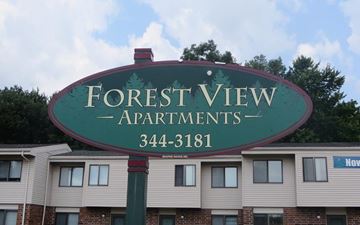 Stevens Point apartment for rent - a sign for forest view apartments in front of a building