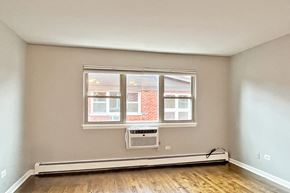 Oak Park apartment for rent - A room with a window and a radiator on the floor.
