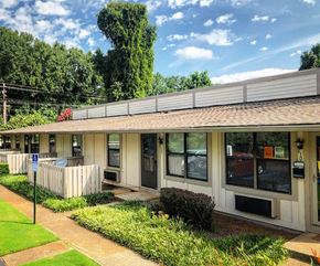 Decatur apartment for rent - a small white house with a porch and a white fence