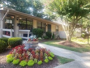 Norcross apartment for rent - a front yard with a fountain in front of a house