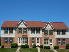 Baltimore apartment for rent - A two story house with a red roof and white siding.