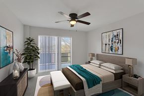 Denver apartment for rent - a bedroom with a bed and a ceiling fan