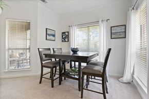 Houston townhouse for rent - A dining room with a table and chairs.