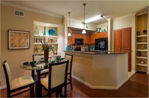 Katy apartment for rent - a kitchen with a bar and a dining table