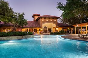 San Antonio apartment for rent - A large house with a pool in front.