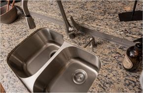 Kingwood apartment for rent - A modern stainless steel kitchen sink with a faucet.