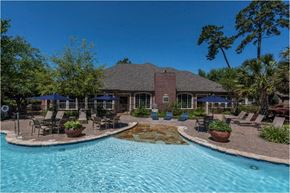 Kingwood apartment for rent - A house with a pool in front of it.