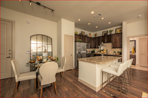 Houston apartment for rent - a kitchen and dining room with a marble counter top and a table and chairs