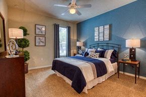 Antonio apartment for rent - a bedroom with a bed and a ceiling fan