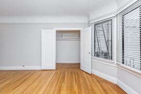 San Francisco apartment for rent - A room with a white door and a window with blinds.