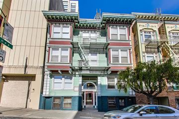 San Francisco apartment for rent - A row of colorful buildings with a tree in front of the first one.
