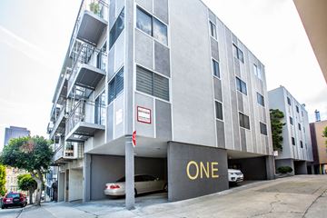 San Francisco apartment for rent - A modern building with the word ONE on the front.