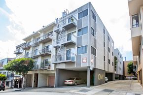 San Francisco apartment for rent - A modern apartment building with a car parked in front.