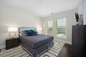 Hoboken apartment for rent - a bedroom with a bed and a rug