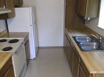 Whitefish apartment for rent - a kitchen with a sink and a stove and a refrigerator