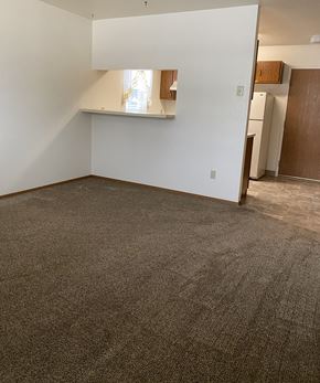 Columbia Falls apartment for rent - Image of carpeted room connected to kitchen