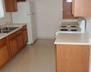 Columbia Falls apartment for rent - a kitchen with a stove and a sink and a refrigerator