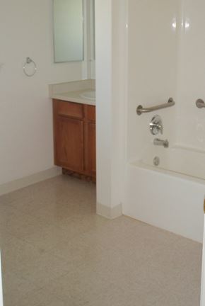 Columbia Falls apartment for rent - Image of sink, mirror, bathtub with support rales, and mirror