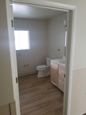 Kalispell apartment for rent - Image of toilet, towel and toilet paper racks, and sink