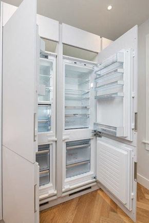 Cambridge apartment for rent - an empty refrigerator with its doors open in a kitchen