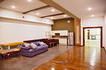 Portland apartment for rent - a large living room with a couch and a kitchen